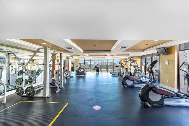 a lobby with furniture and stairs