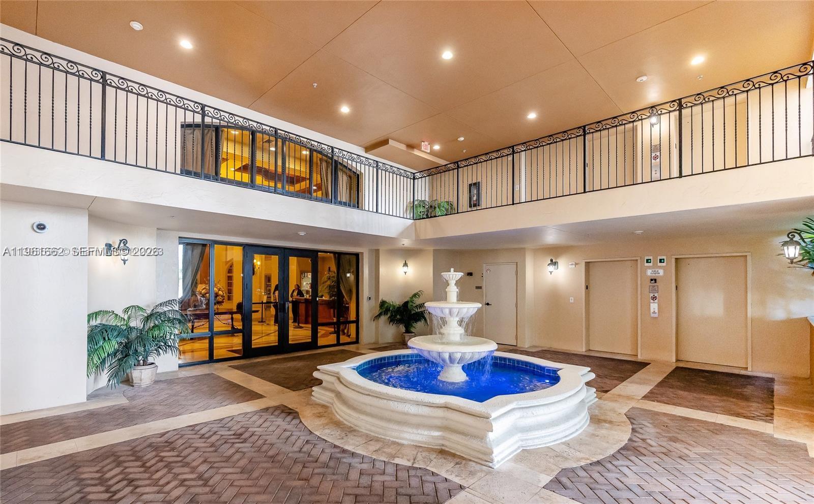 888 Douglas Road, Unit 1401 Coral Gables, FL 33134 - Photo 37 of 43 a lobby with furniture and outdoor space