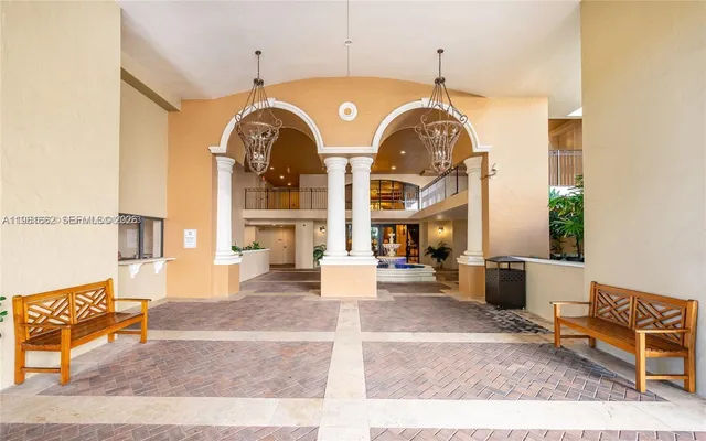 a view of a building with sitting area