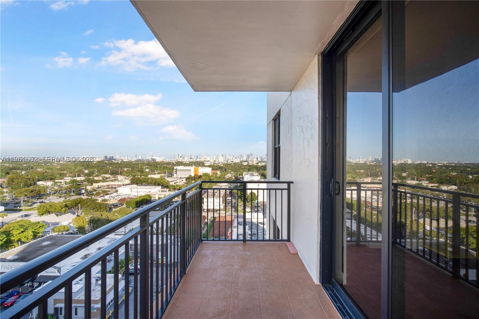 888 Douglas Road, Unit 1401 Coral Gables, FL 33134 - Photo 6 of 43 a view of a balcony with city