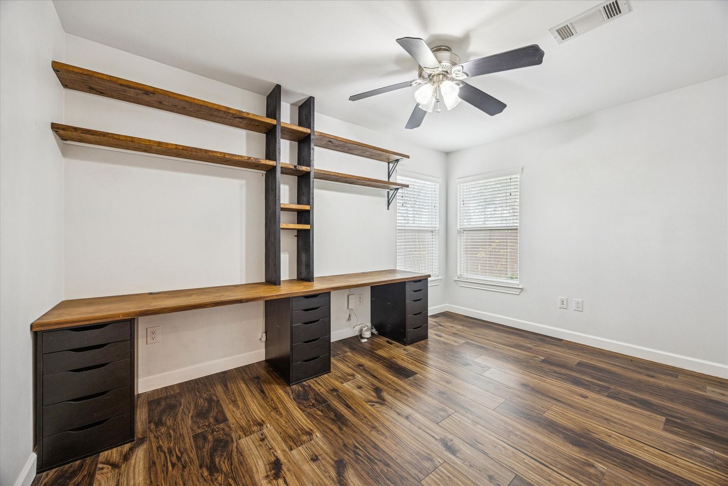 2921 Pecan Springs Road Austin, TX 78723 - Photo 16 of 21 wooden floor in an empty room with a window