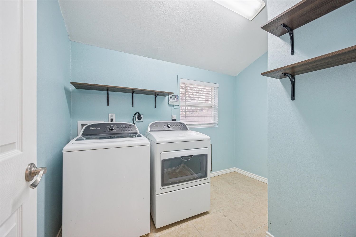2921 Pecan Springs Road Austin, TX 78723 - Photo 18 of 21 a utility room with dryer and washer