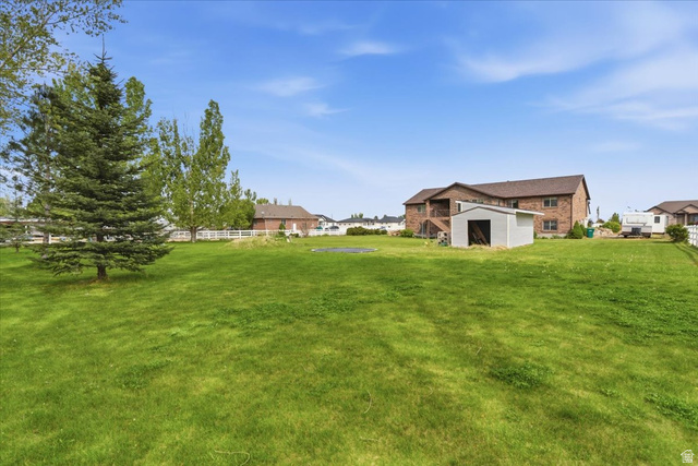 6237 West 4600th Street South Hooper, UT 84315 - Photo 44 of 48 View of yard with an outdoor structure