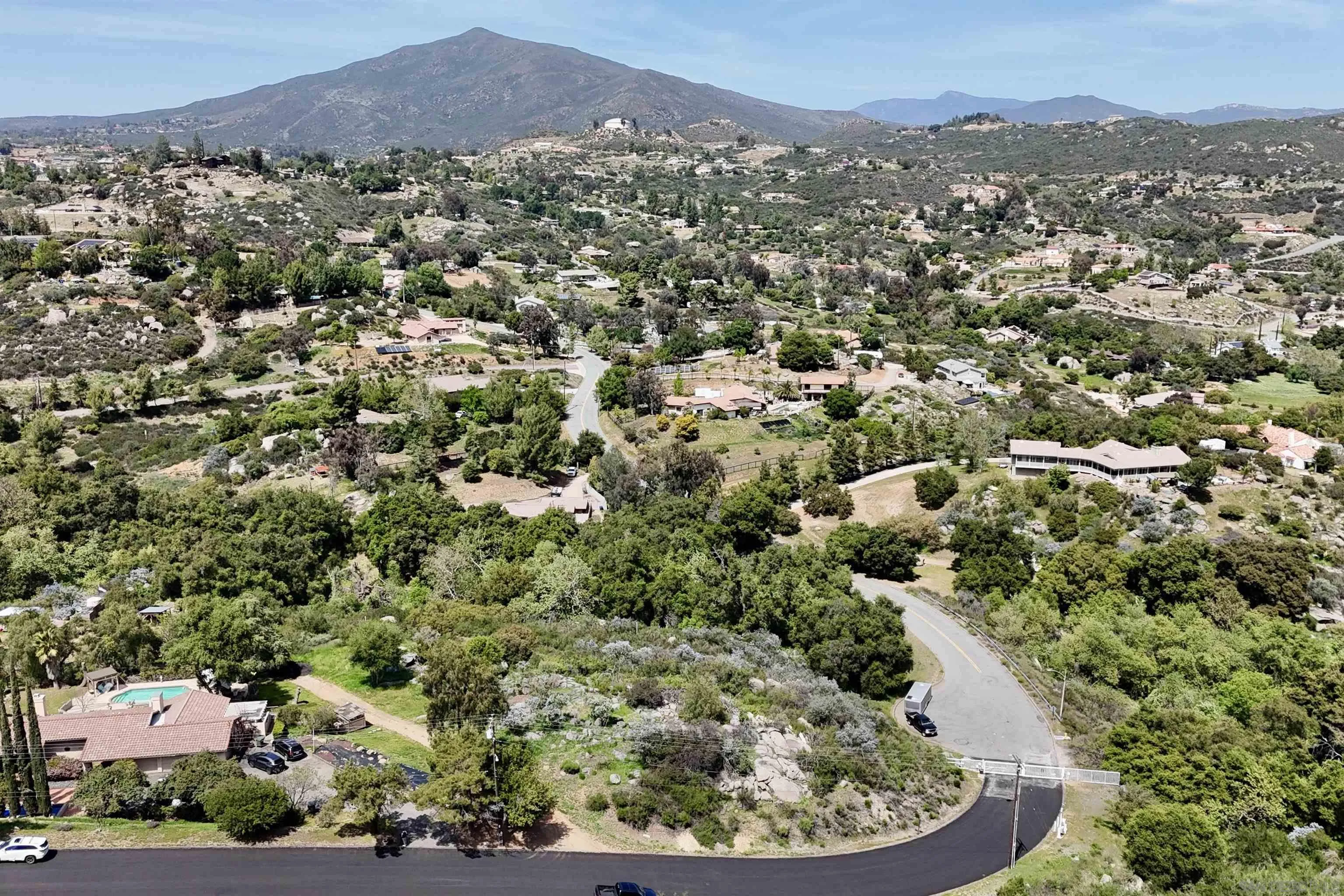 Via Viejas Oeste, Unit 43 Alpine, CA 91901 - Photo 14 of 28 an aerial view of a houses with a street and green space