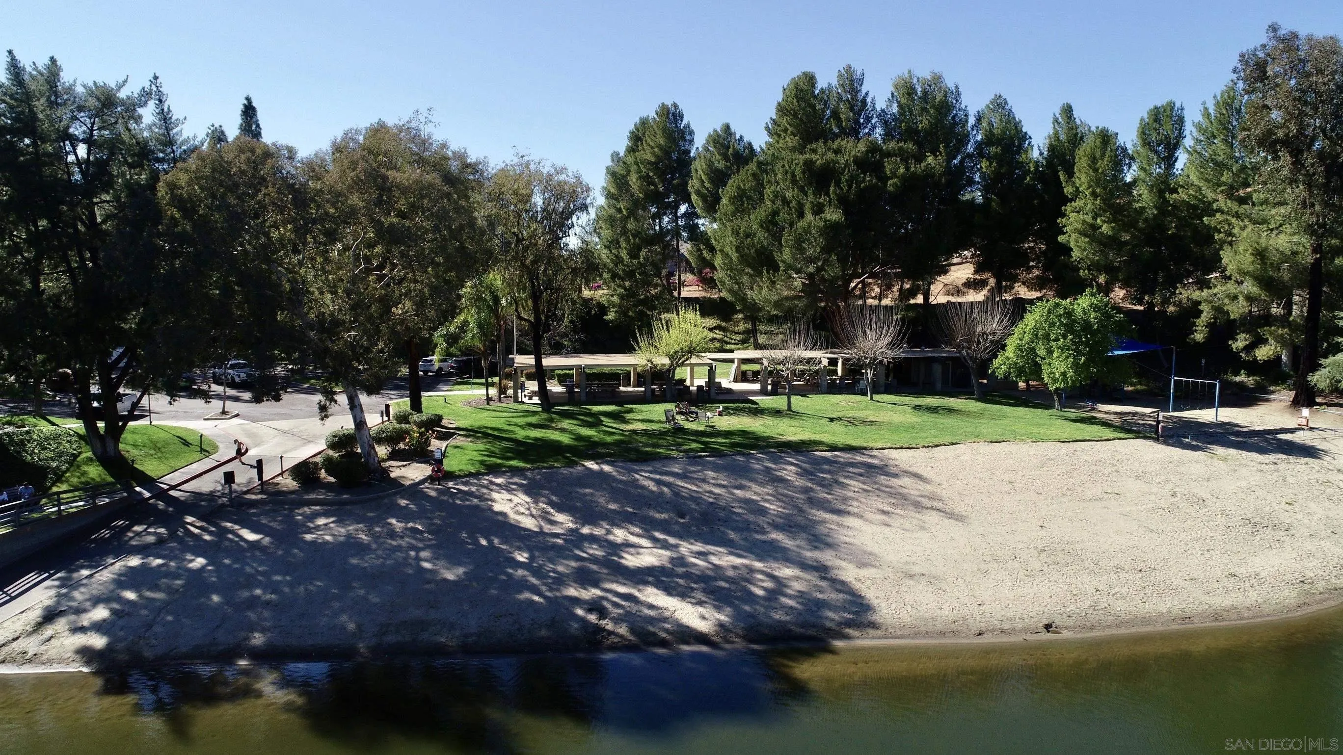 Via Viejas Oeste, Unit 43 Alpine, CA 91901 - Photo 28 of 28 a swimming pool with outdoor seating and trees