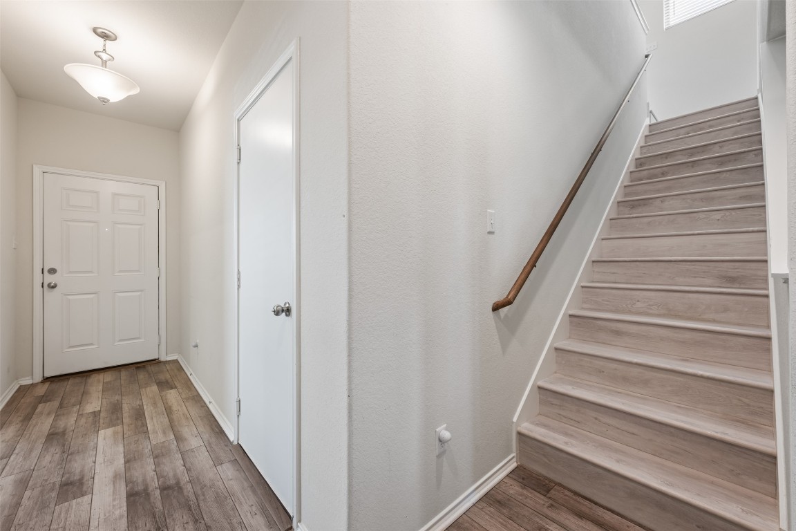 225 Gunther Way Taylor, TX 76574 - Photo 27 of 40 a view of entryway with wooden floor