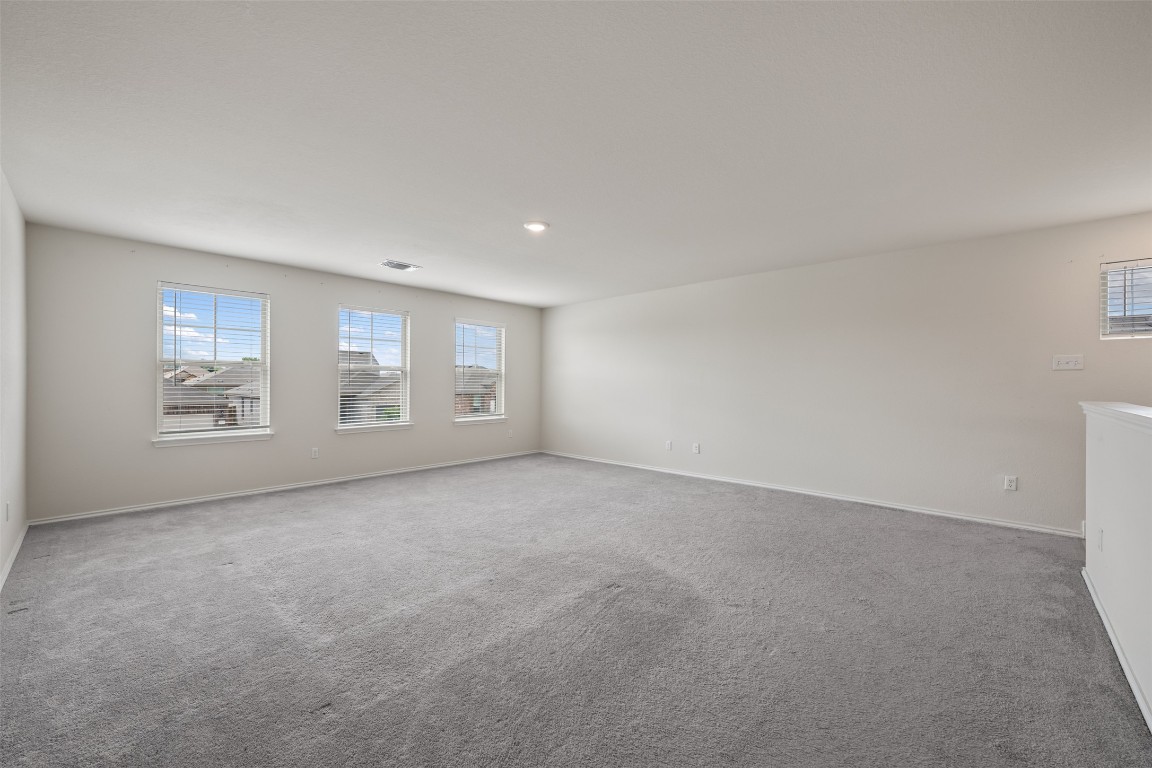 225 Gunther Way Taylor, TX 76574 - Photo 30 of 40 a view of an empty room with windows