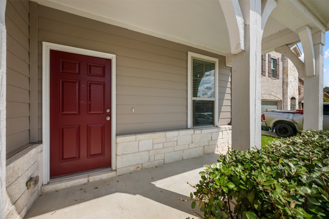 225 Gunther Way Taylor, TX 76574 - Photo 3 of 40 a front view of a house with a yard