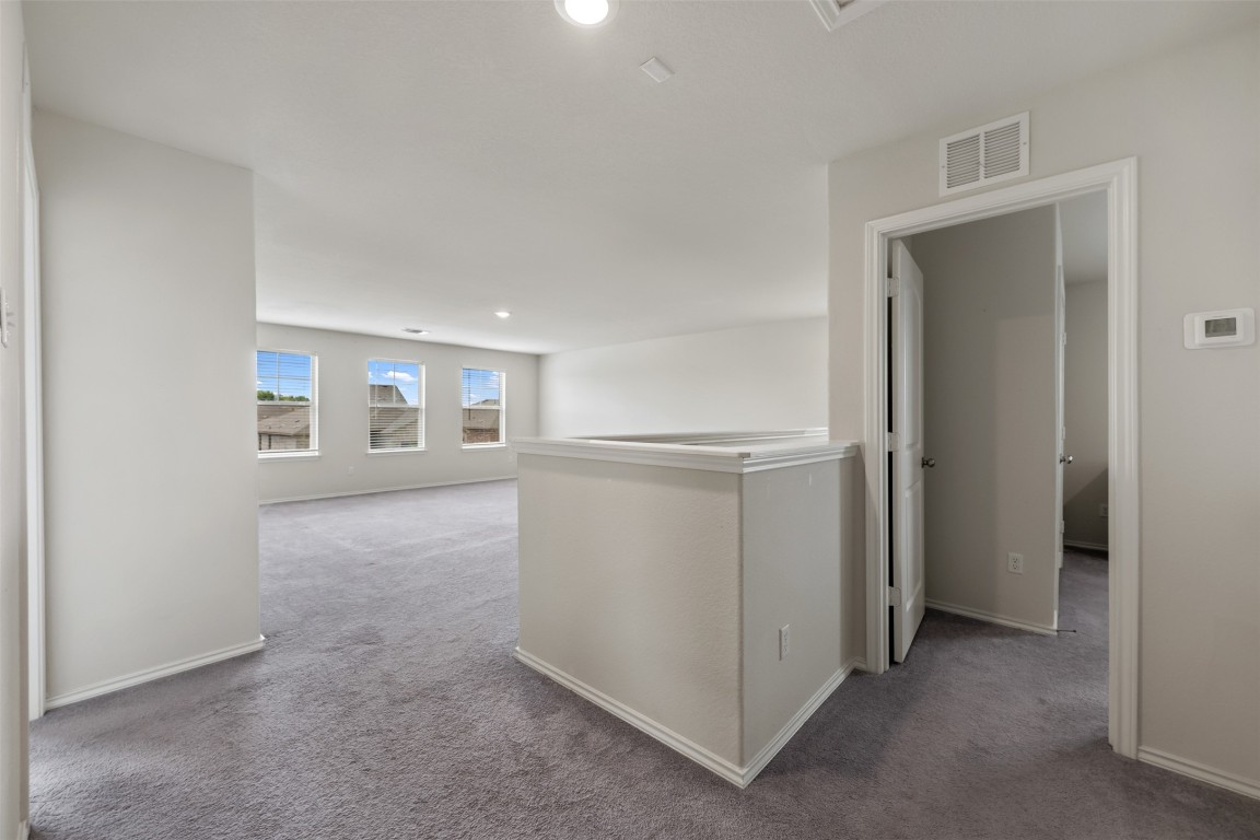 225 Gunther Way Taylor, TX 76574 - Photo 31 of 40 an empty room with windows and closet