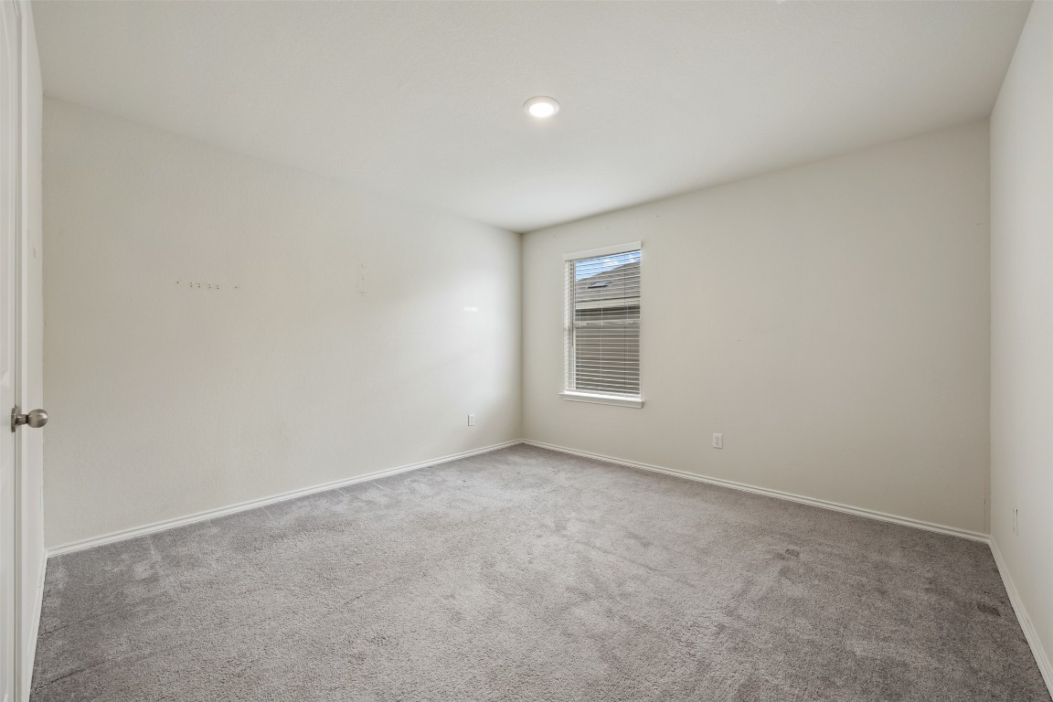 225 Gunther Way Taylor, TX 76574 - Photo 33 of 40 an empty room with windows