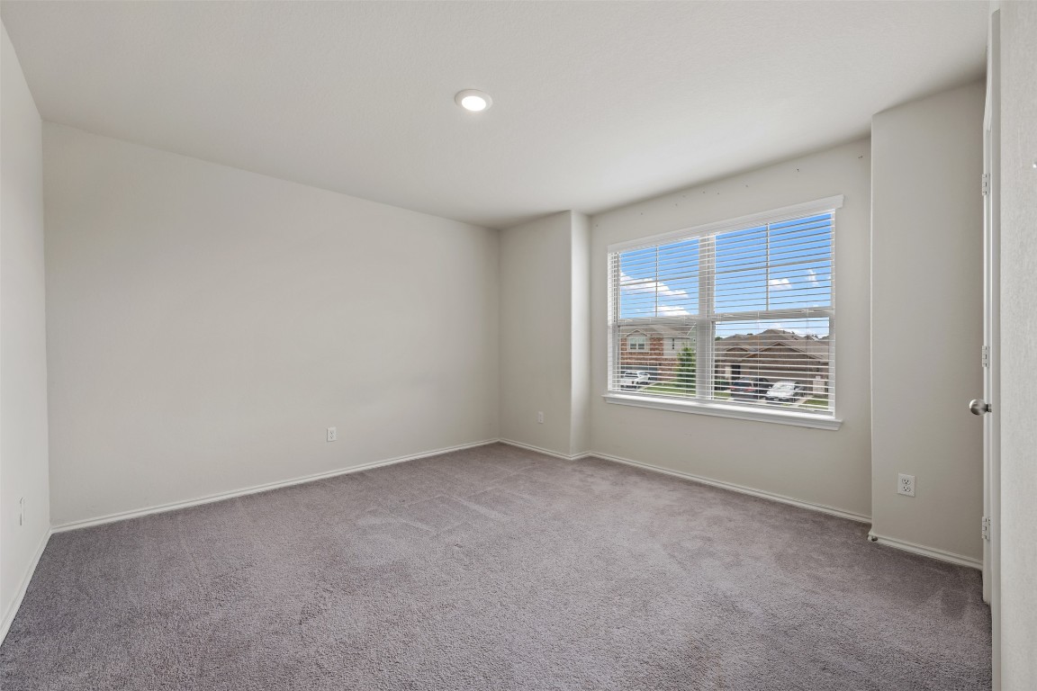 225 Gunther Way Taylor, TX 76574 - Photo 34 of 40 a view of an empty room with a window