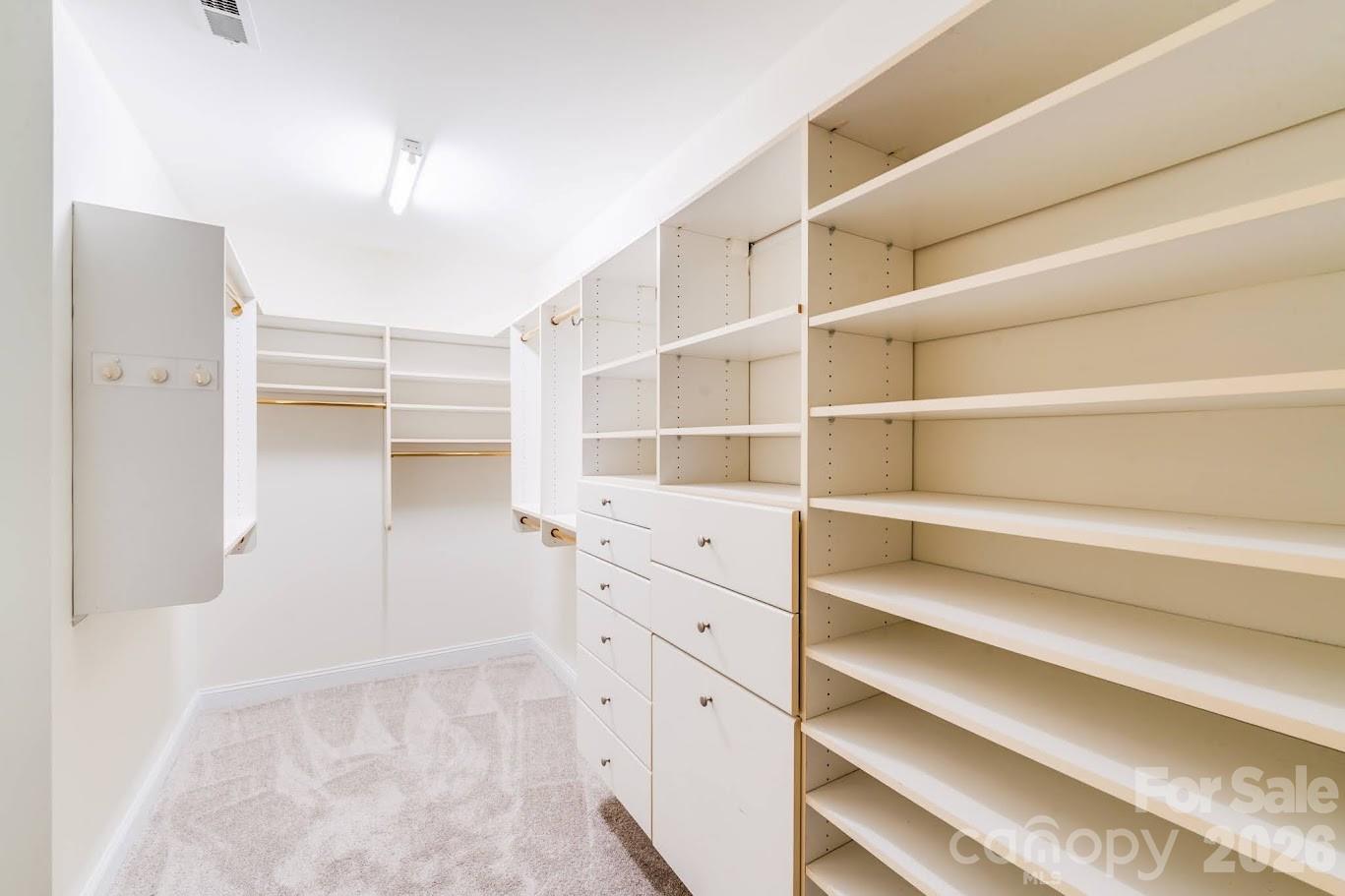 5601 Fairview Road, Unit 10 Charlotte, NC 28209 - Photo 20 of 28 a view of walk in closet with empty racks