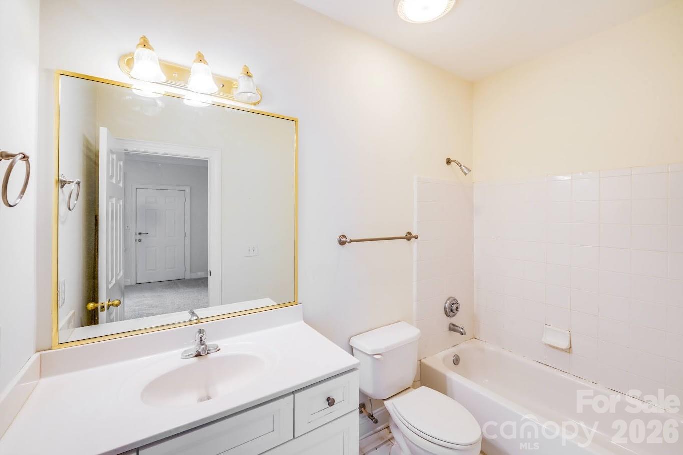 5601 Fairview Road, Unit 10 Charlotte, NC 28209 - Photo 24 of 28 a bathroom with a sink toilet and shower