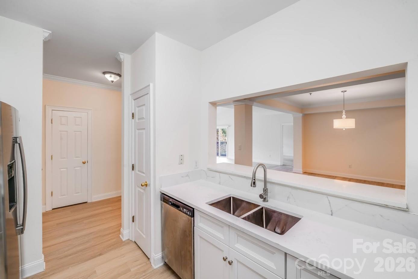 5601 Fairview Road, Unit 10 Charlotte, NC 28209 - Photo 7 of 28 a kitchen with a sink and cabinets