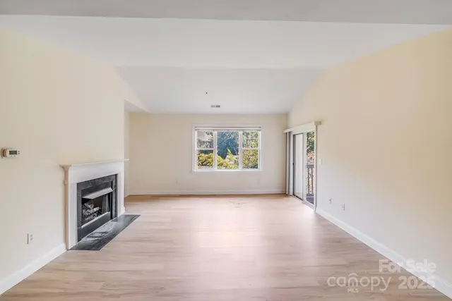 a view of a livingroom with a fireplace