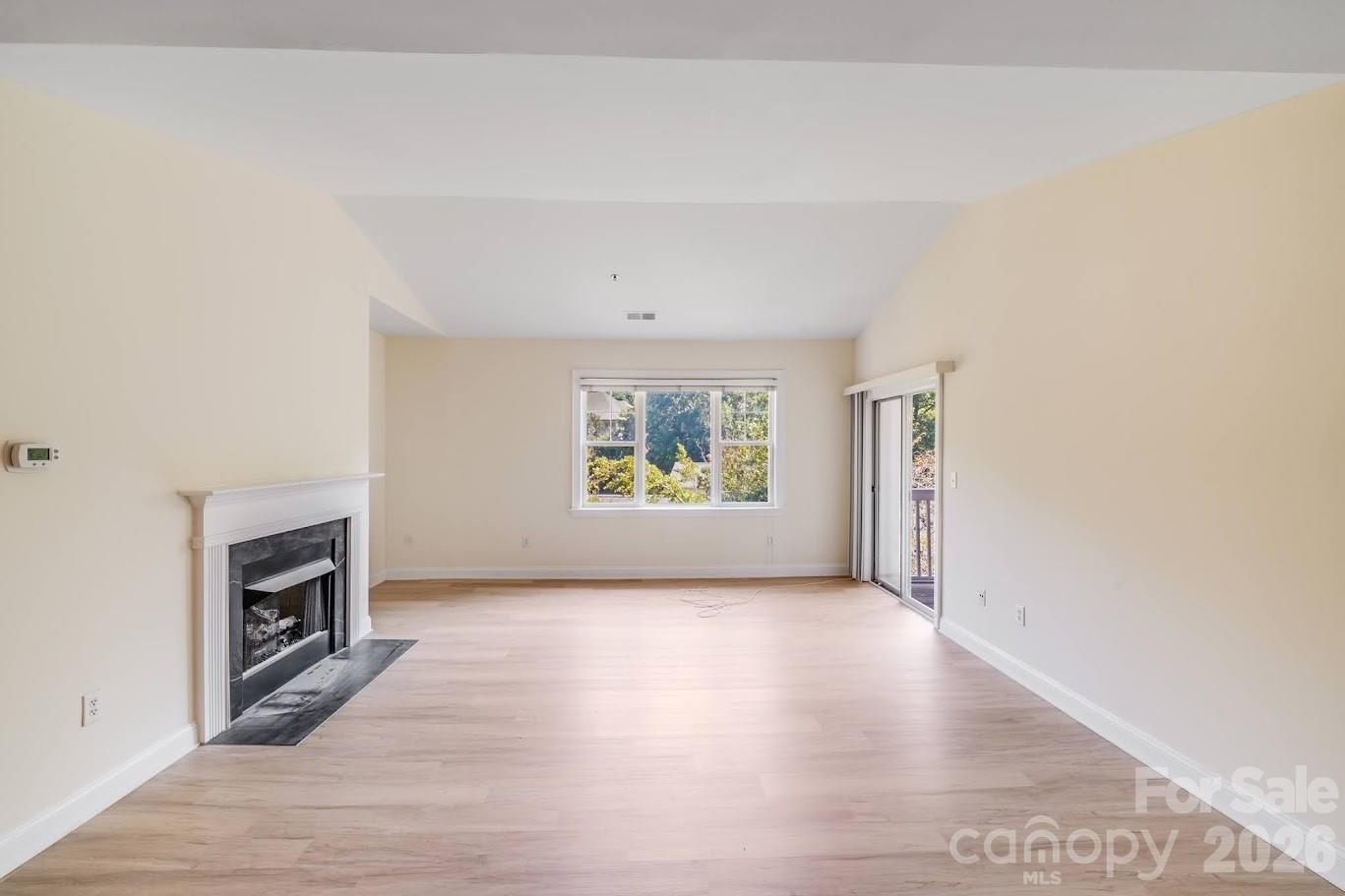 5601 Fairview Road, Unit 10 Charlotte, NC 28209 - Photo 8 of 28 a view of a livingroom with a fireplace
