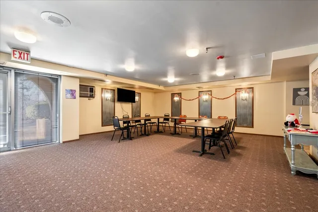 a view of a room with wooden walls