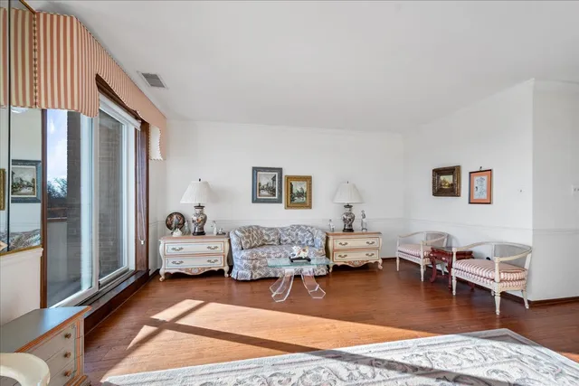 a living room with furniture or couch and a wooden floor