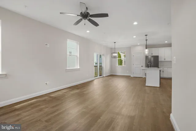 a view of a kitchen with a dishwasher and a refrigerator