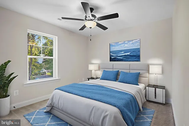 a bedroom with a large bed and a window