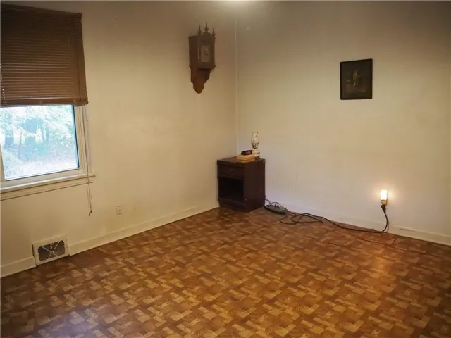 a view of empty room with windows