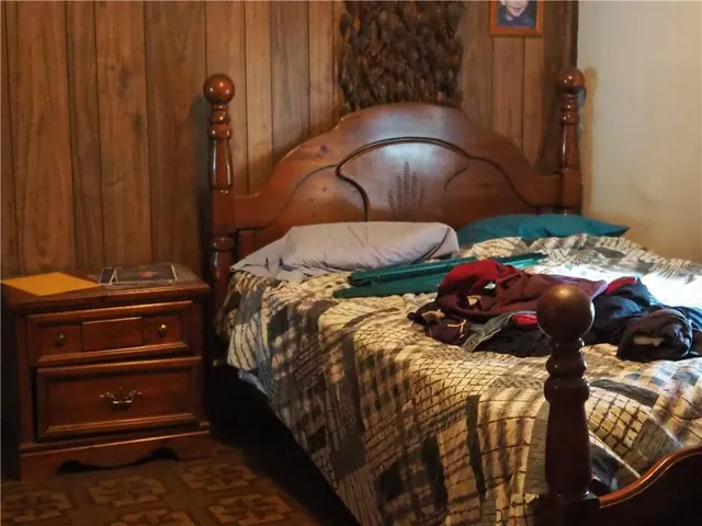 a bedroom with a bed and a closet