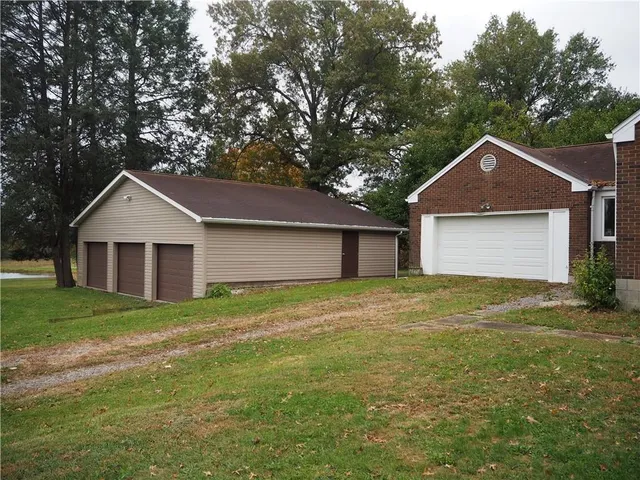 a view of a yard with a tree