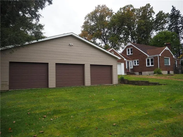 a front view of a house with yard