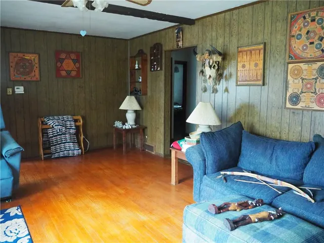 a living room with furniture and a table