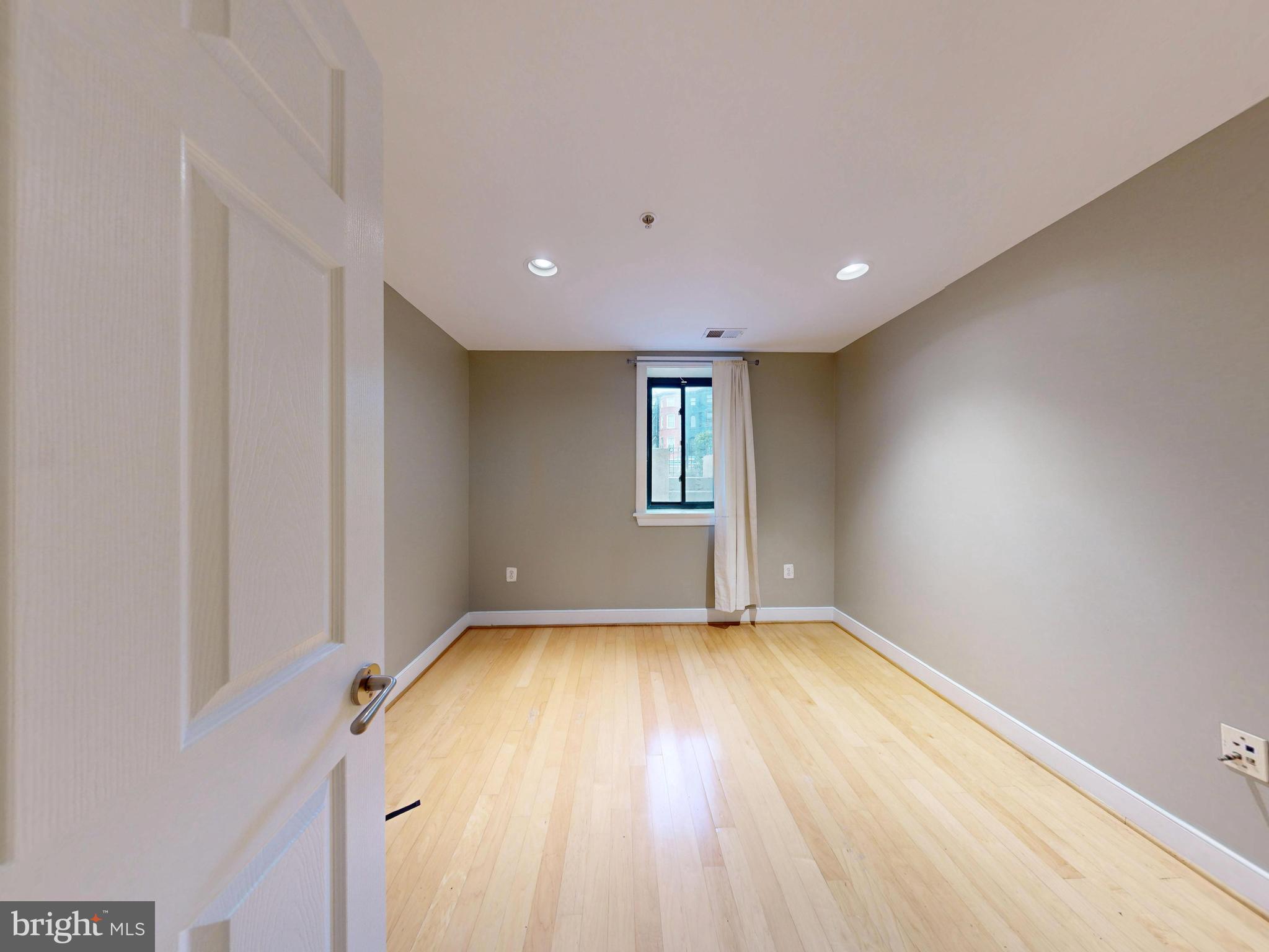 6 Rhode Island Avenue Northwest, Unit 2 Washington, DC 20001 - Photo 14 of 29 a view of empty room with wooden floor and fan