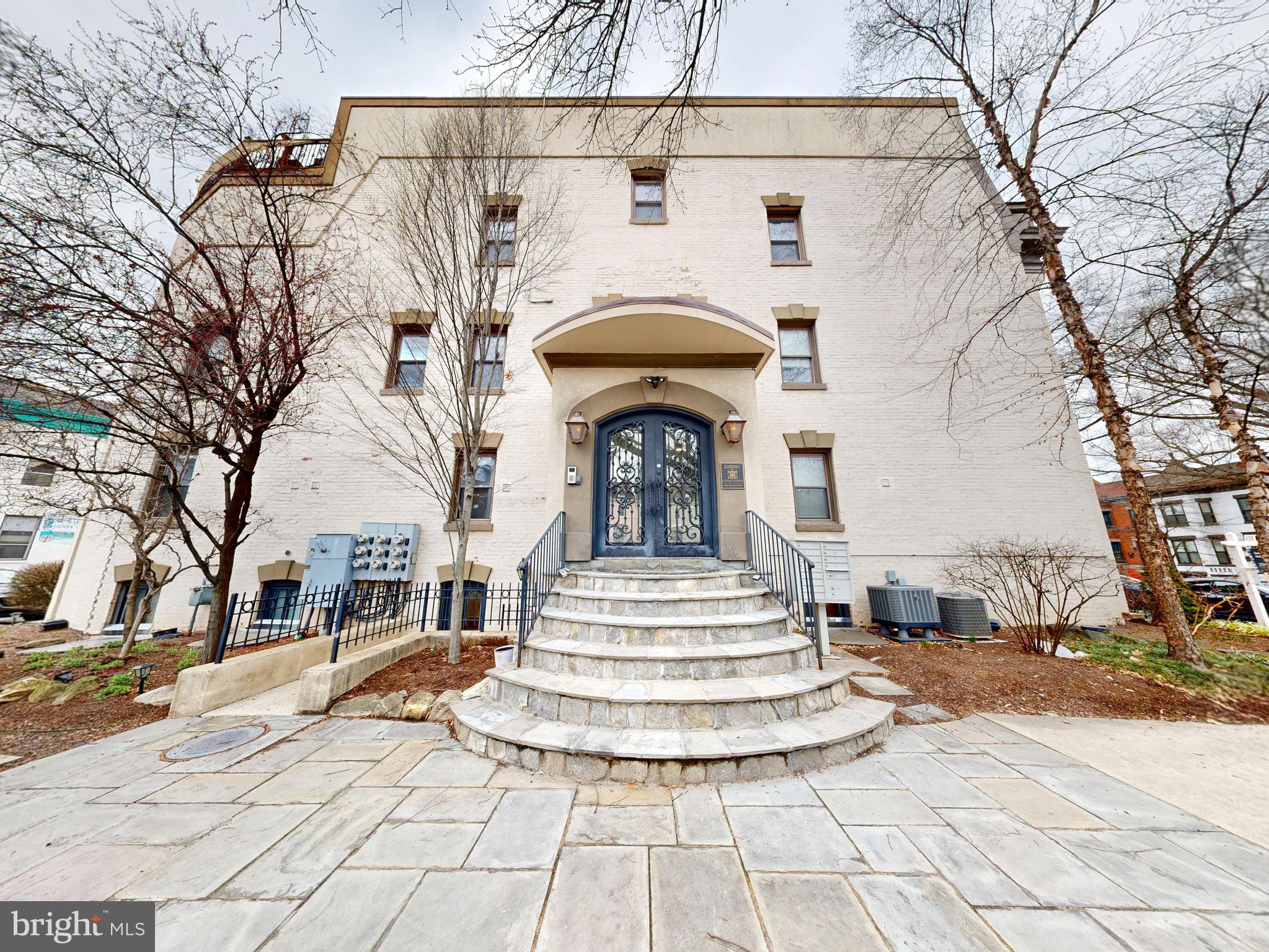 6 Rhode Island Avenue Northwest, Unit 2 Washington, DC 20001 - Photo 2 of 29 a view of a white house with a large tree
