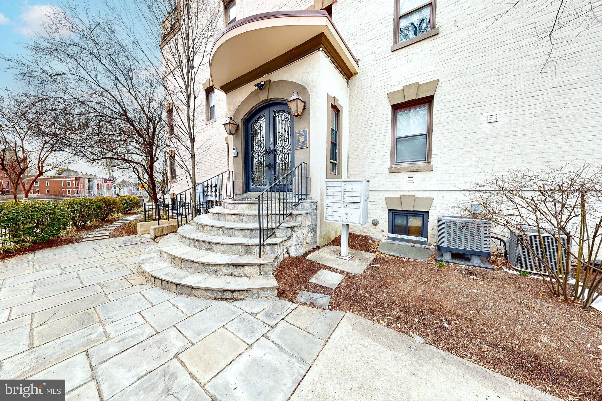 6 Rhode Island Avenue Northwest, Unit 2 Washington, DC 20001 - Photo 24 of 29 a front view of a house with a garden