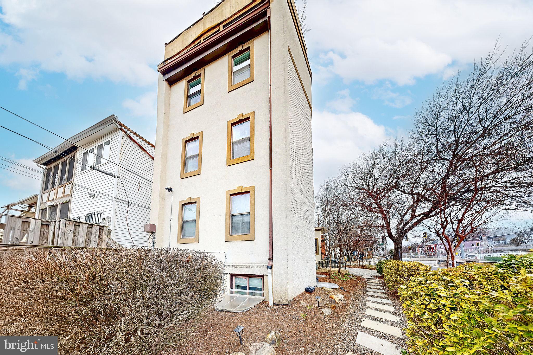 6 Rhode Island Avenue Northwest, Unit 2 Washington, DC 20001 - Photo 28 of 29 a front view of a house with a yard