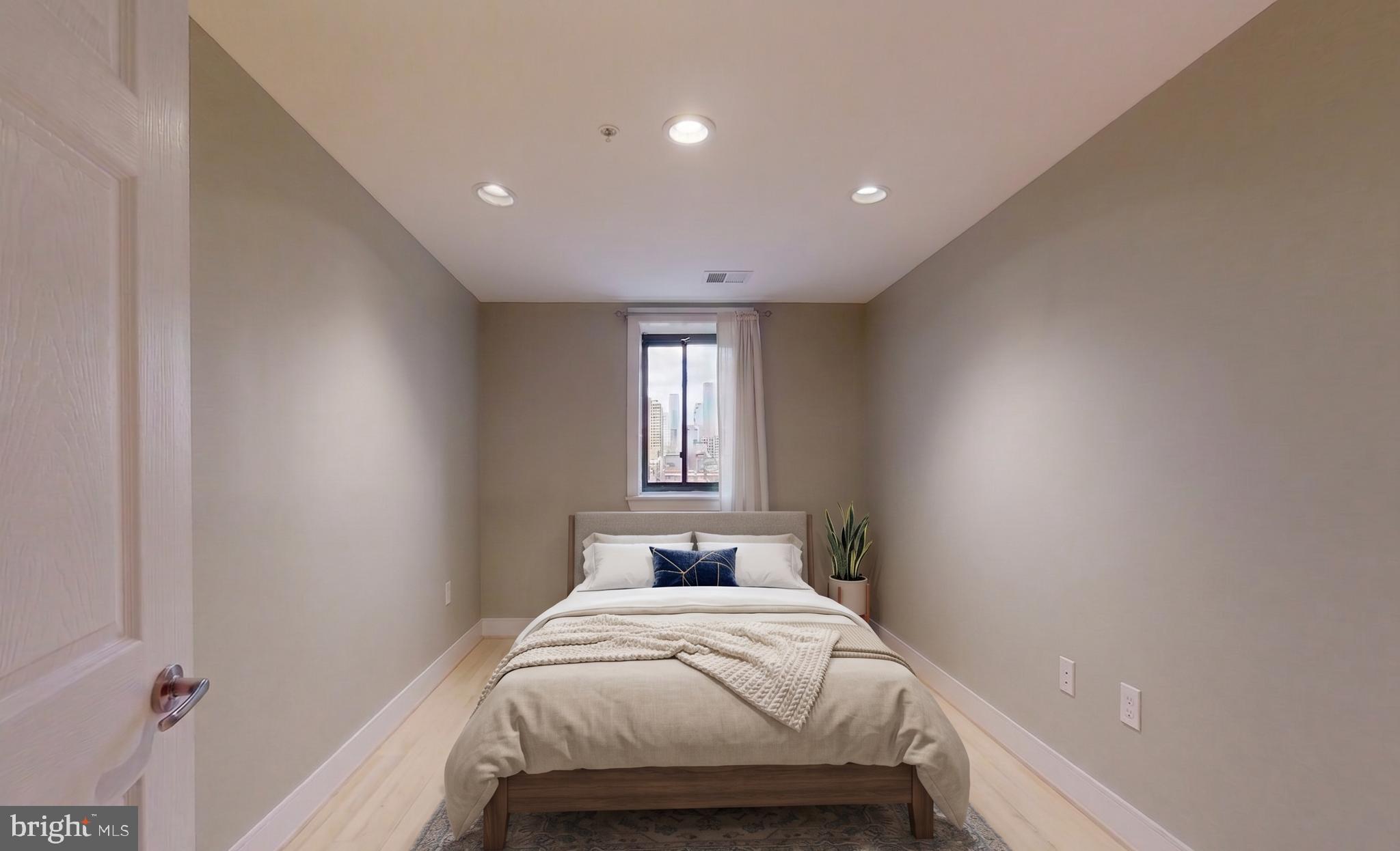 6 Rhode Island Avenue Northwest, Unit 2 Washington, DC 20001 - Photo 5 of 29 a bedroom with a bed and window