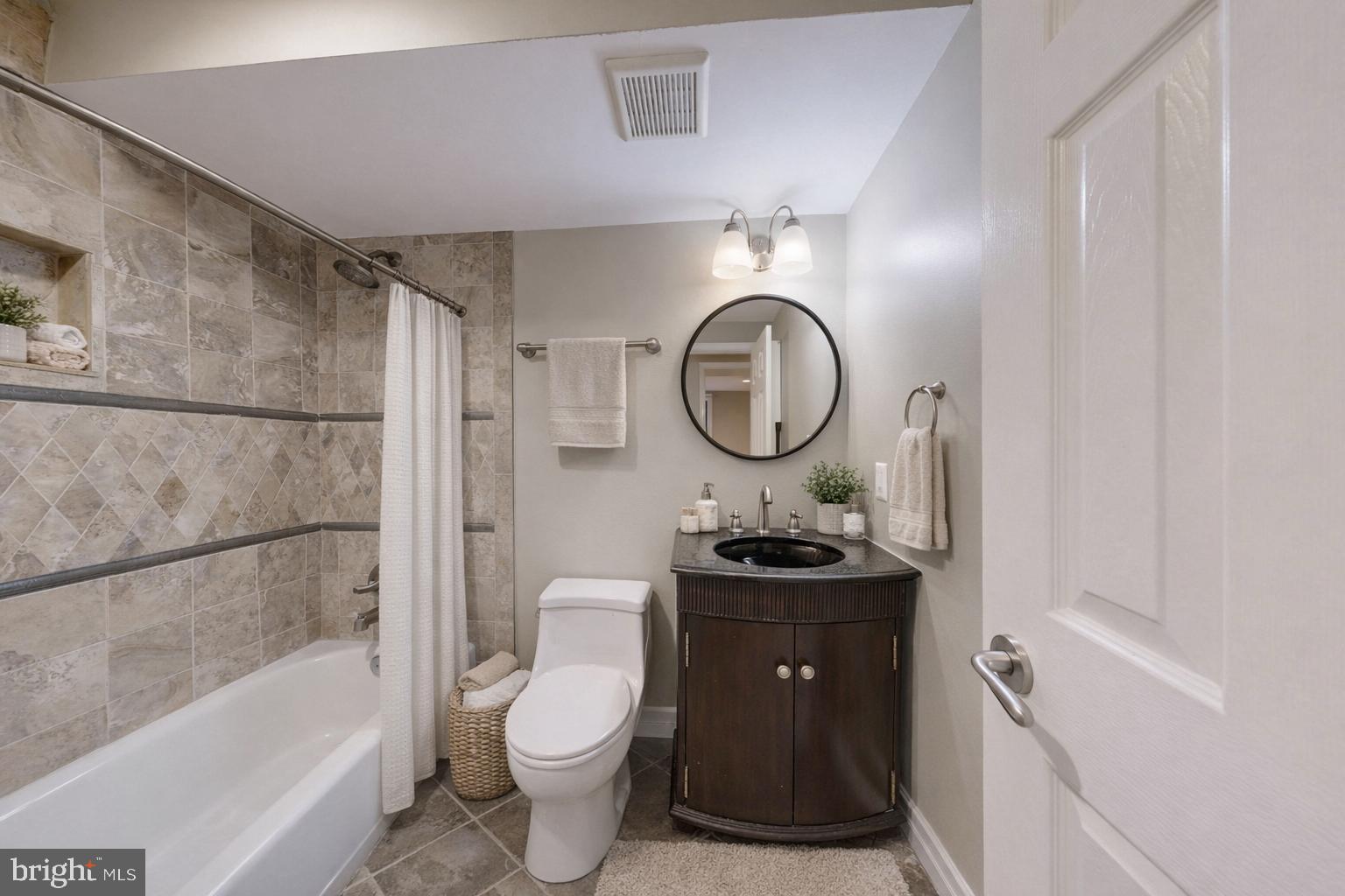 6 Rhode Island Avenue Northwest, Unit 2 Washington, DC 20001 - Photo 7 of 29 a bathroom with a toilet sink vanity granite tub and shower