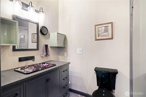 a kitchen with a sink a stove and cabinets