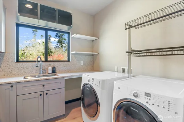a utility room with dryer and washer
