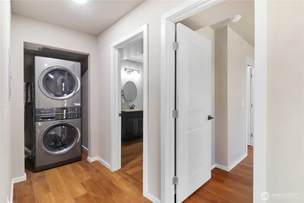 a view of a hallway with washer and dryer