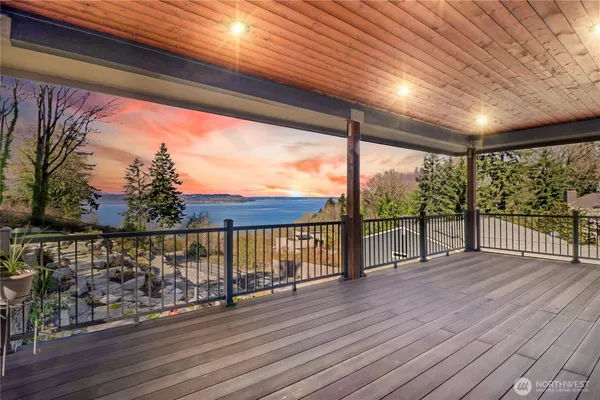 a view of a balcony with wooden floor