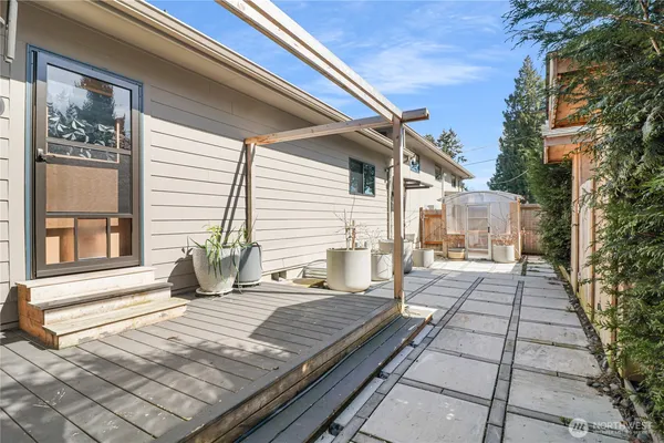 a view of a house with backyard and sitting area