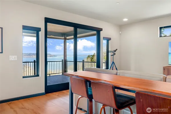 a dining room with furniture and a window