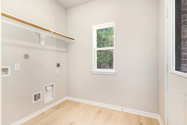 a view of a house with a garden and pathway