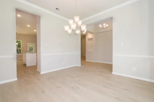 a view of an empty room with a bathroom