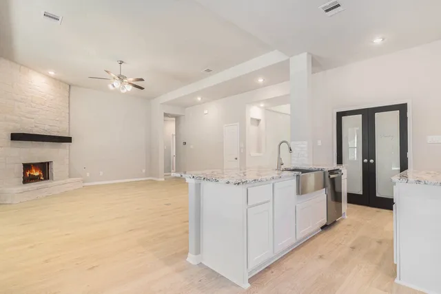 a kitchen with a stove and a sink