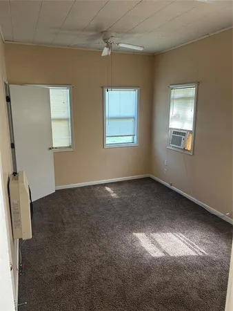 a view of empty room with windows