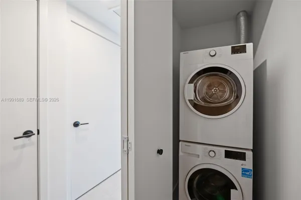 a view of livingroom with washer and dryer