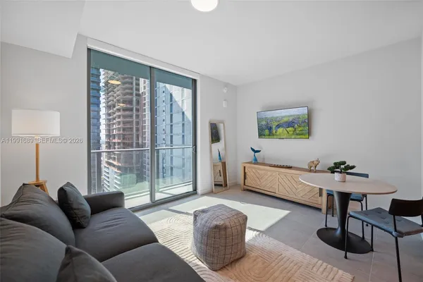 a living room with furniture and a window
