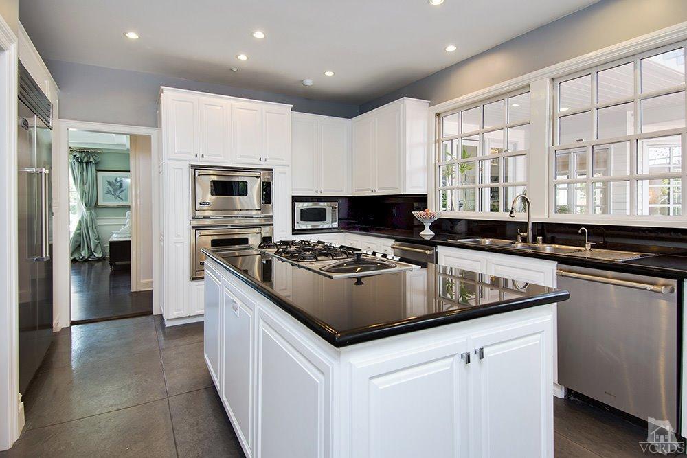 1784 Upper Ranch Road Westlake Village, CA 91362 - Photo 16 of 53 a kitchen that has a sink and a stove in it