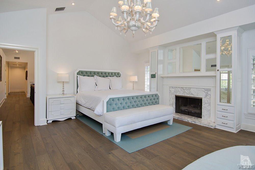 1784 Upper Ranch Road Westlake Village, CA 91362 - Photo 27 of 53 a bedroom with a bed and a fireplace