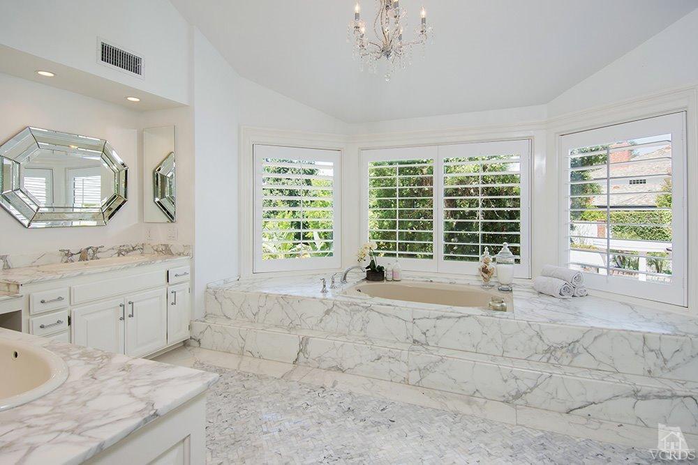 1784 Upper Ranch Road Westlake Village, CA 91362 - Photo 28 of 53 a spacious bathroom with double vanity a window a mirror and a bathtub